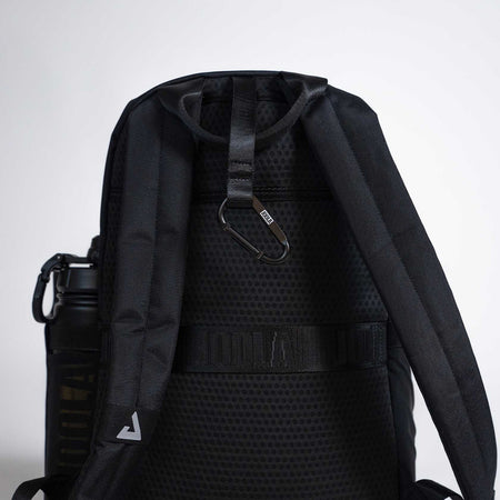 Black JOOLA backpack with a water bottle holder on a light gray background