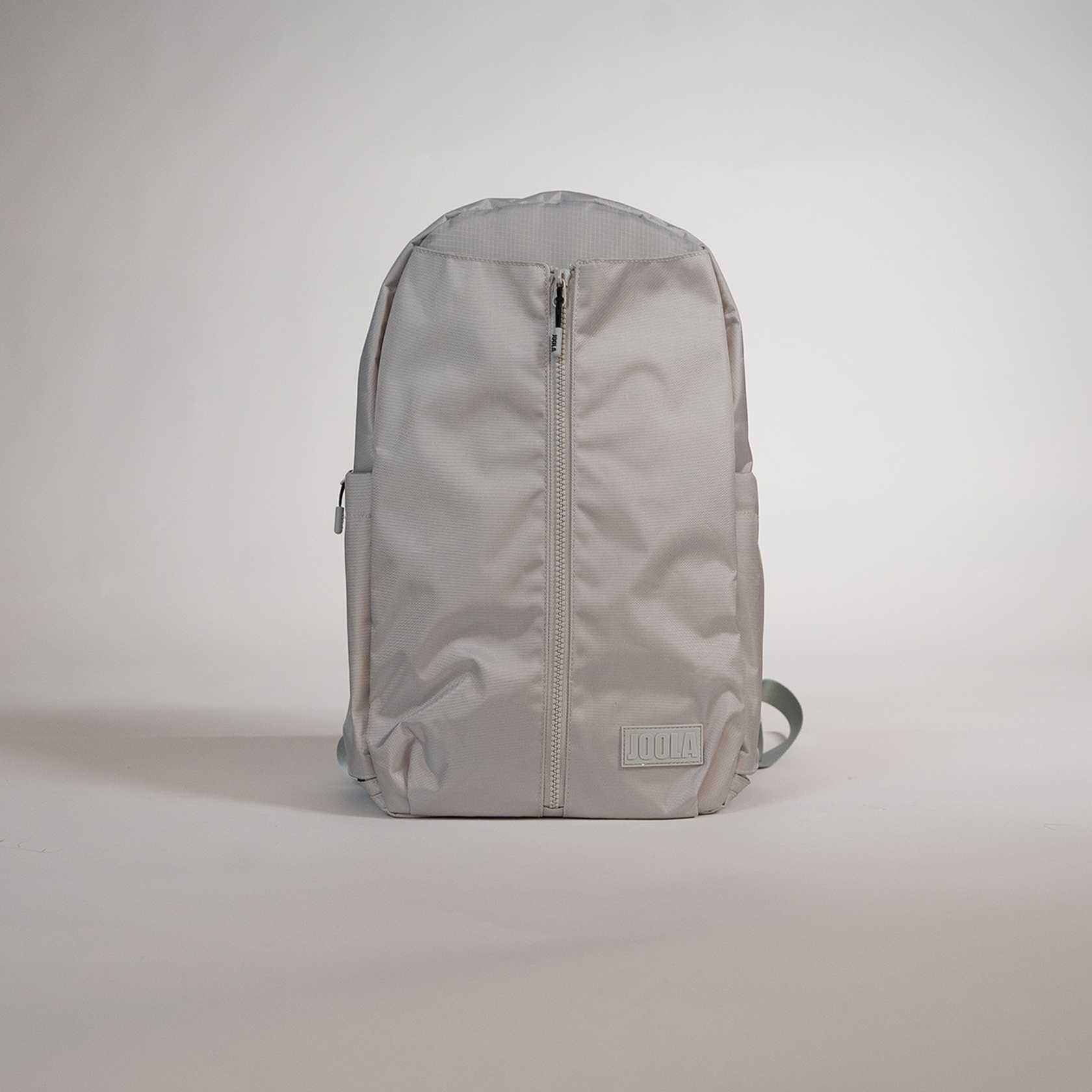 Gray JOOLA backpack on a light gray background.