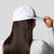 Product image of a white and black JOOLA Two-in-One Sun Cap.