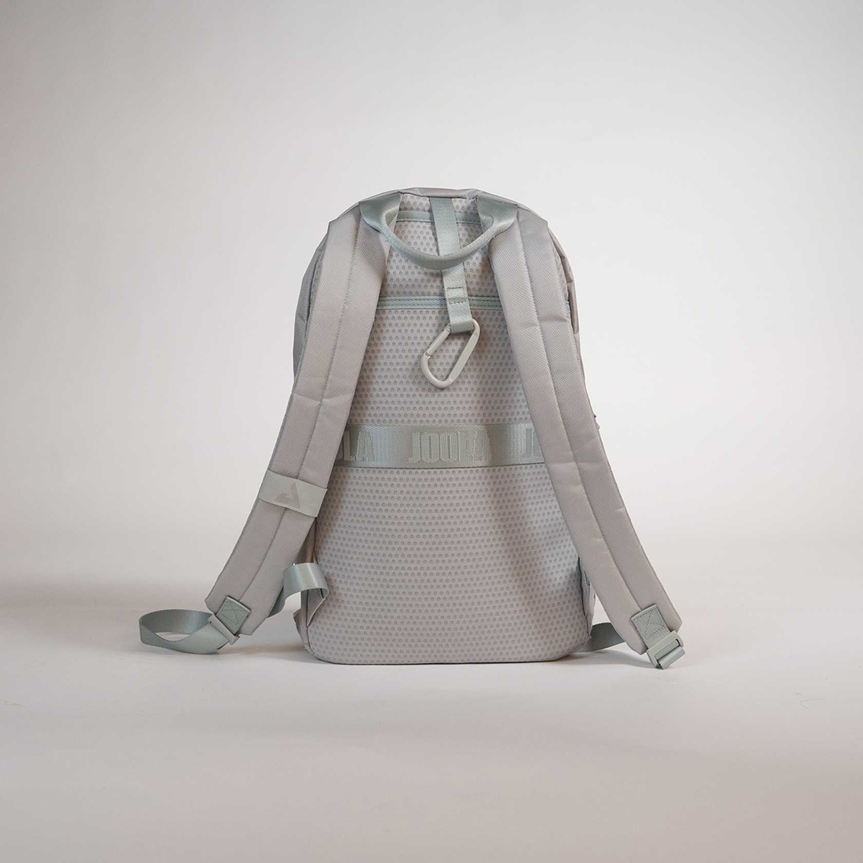 Gray JOOLA backpack on a light gray background