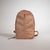 Brown JOOLA backpack on a light gray background.