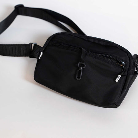 Black waist bag on a white background.