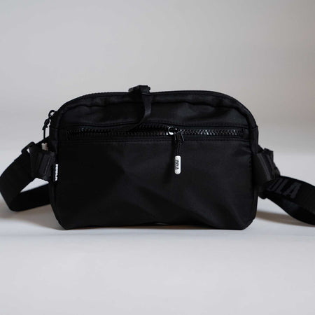 Black waist bag on a light gray background