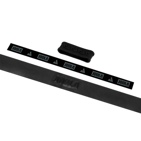 White background, image of black JOOLA Fel-Tec Pure Grip unrolled with a black JOOLA rubber band pictured.