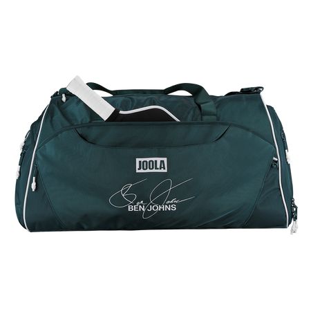 A dark teal green JOOLA duffel bag with white piping and a personalized Ben Johns signature print on the front, shown on a solid white background.