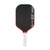Pickleball paddle with black surface, red border, and white handle on a white background