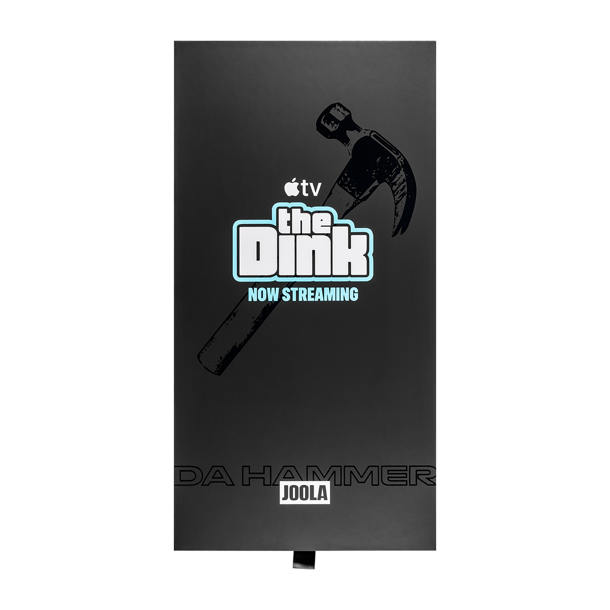A black rectangular stand or plaque featuring a hammer graphic and the text 'The Dink NOW STREAMING' with Apple TV branding, plus 'JOOLA' near the bottom, shown on a white background.