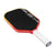 Pickleball paddle with black surface, red frame, and white handle on a white background