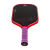 White background, product image of the JOOLA Perseus Pro V JOOLA x Steve Aoki pickleball paddle, purple handle and red edge guard.