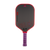 White background, product image of the JOOLA Perseus Pro V JOOLA x Steve Aoki pickleball paddle, purple handle and red edge guard.