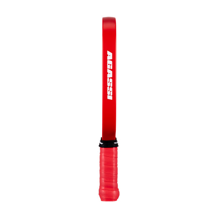 White background, image of the Agassi wordmark on the side of a Agassi Pro Miniature paddle.
