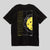 Gray background, product image of the back of the JOOLA Global Pickleball graphic tee. Black tee with white and yellow pickleball graphic.