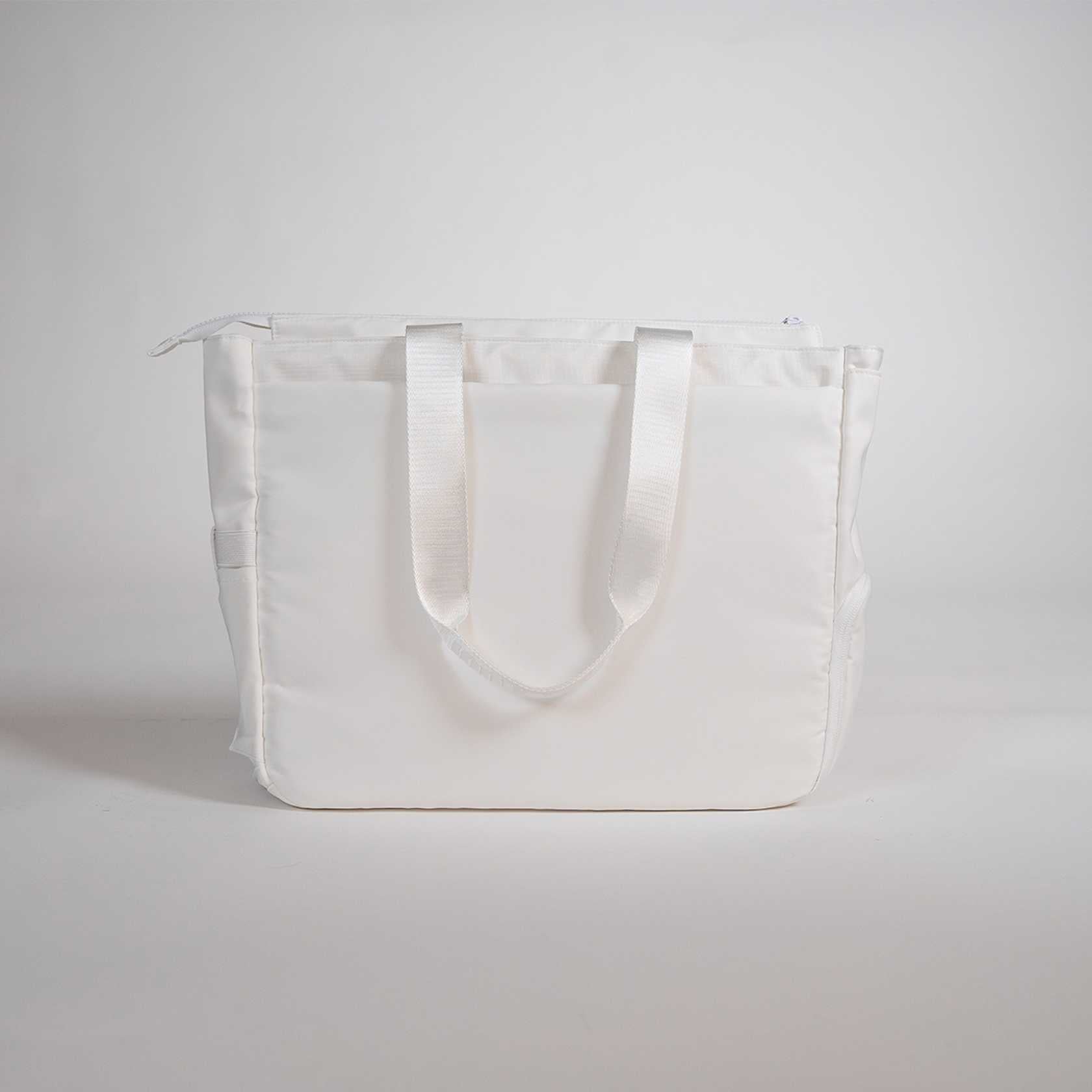 White JOOLA tote bag on a light gray background