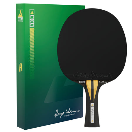 White background, product image of the JOOLA x Hugo Calderano table tennis racket, black rubber surface, and product packaging featured.