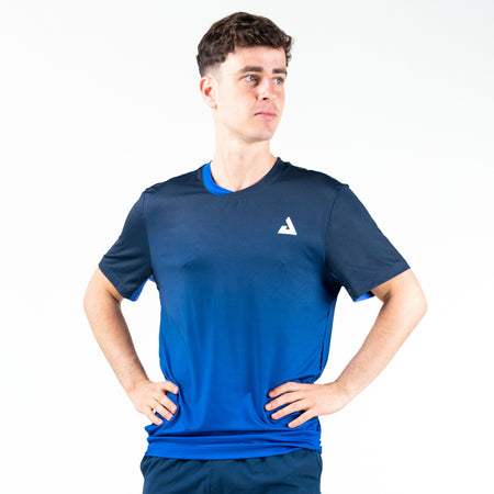 White background, image of a male model wearing a JOOLA Competition Blue JOOLA Table Tennis shirt.