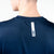 White background, close up image of the JOOLA logo on the upper back of a JOOLA Men's Competition Table Tennis shirt, blue.