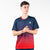 White background, image of a male model wearing a red and blue JOOLA Competition Table Tennis shirt.