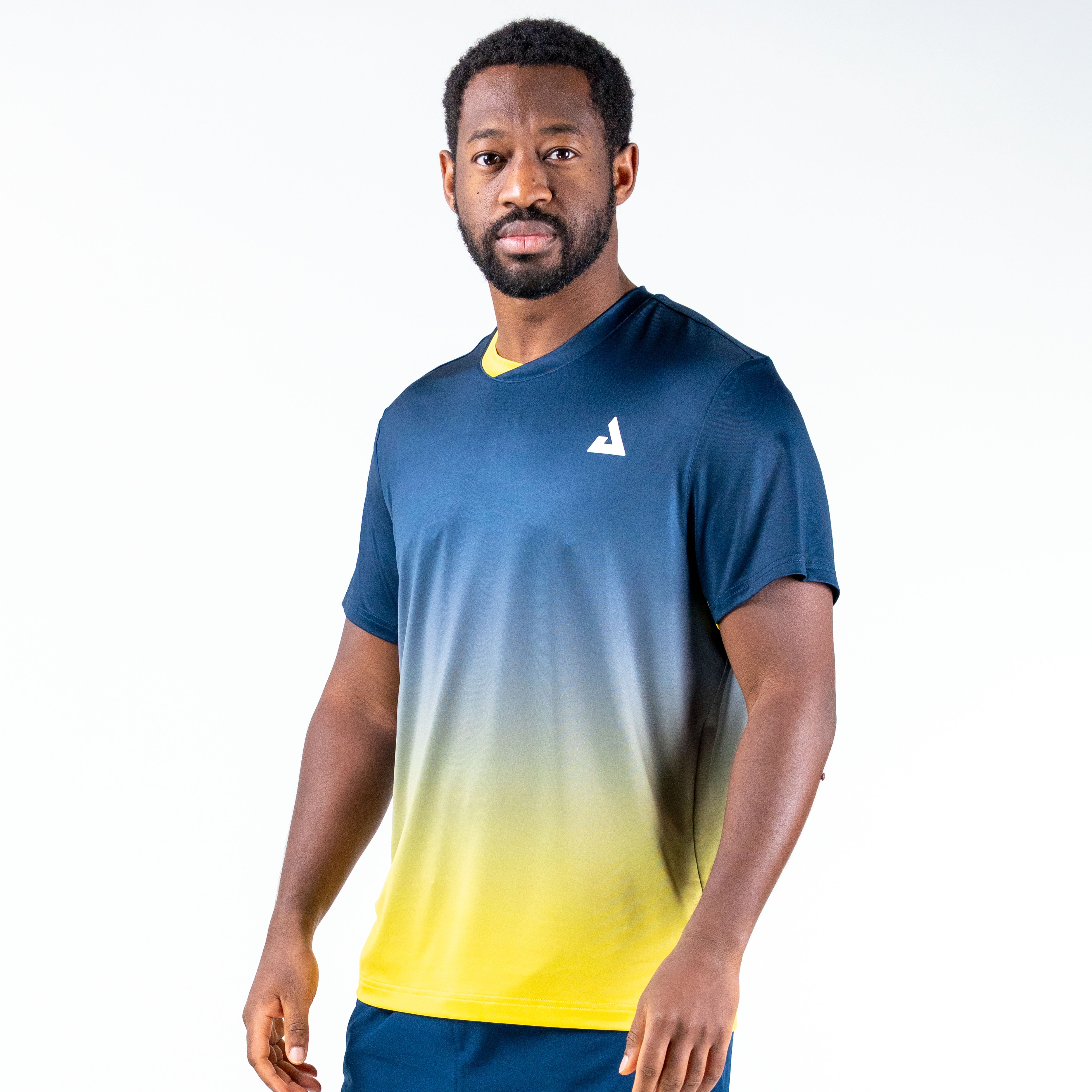 White background, image showing a male  model wearing a two tone blue and yellow JOOLA Table Tennis competition shirt.