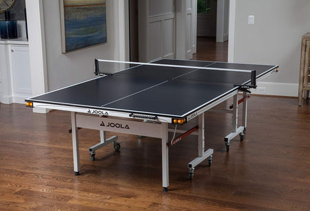 Image showing the JOOLA Rapid Play indoor table tennis table set up inside.