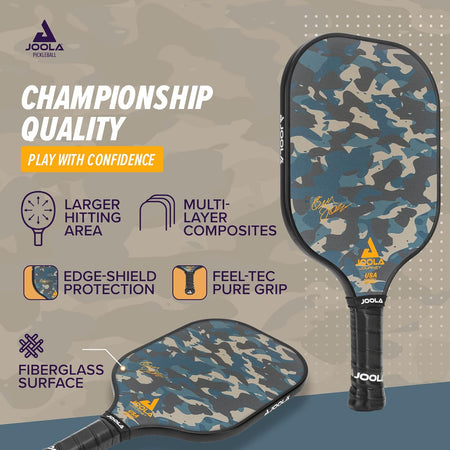 Camouflage pickleball paddle with JOOLA branding and feature text on a gray background