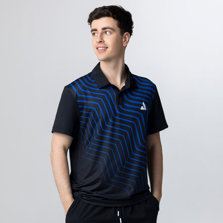 Gray background, image of a male model wearing a black and blue patteren JOOLA Table Tennis Team Polo.