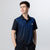Gray background, image of a male model wearing a black and blue patteren JOOLA Table Tennis Team Polo.
