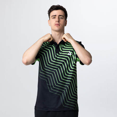 Person wearing a black and green striped shirt with a logo on a white background