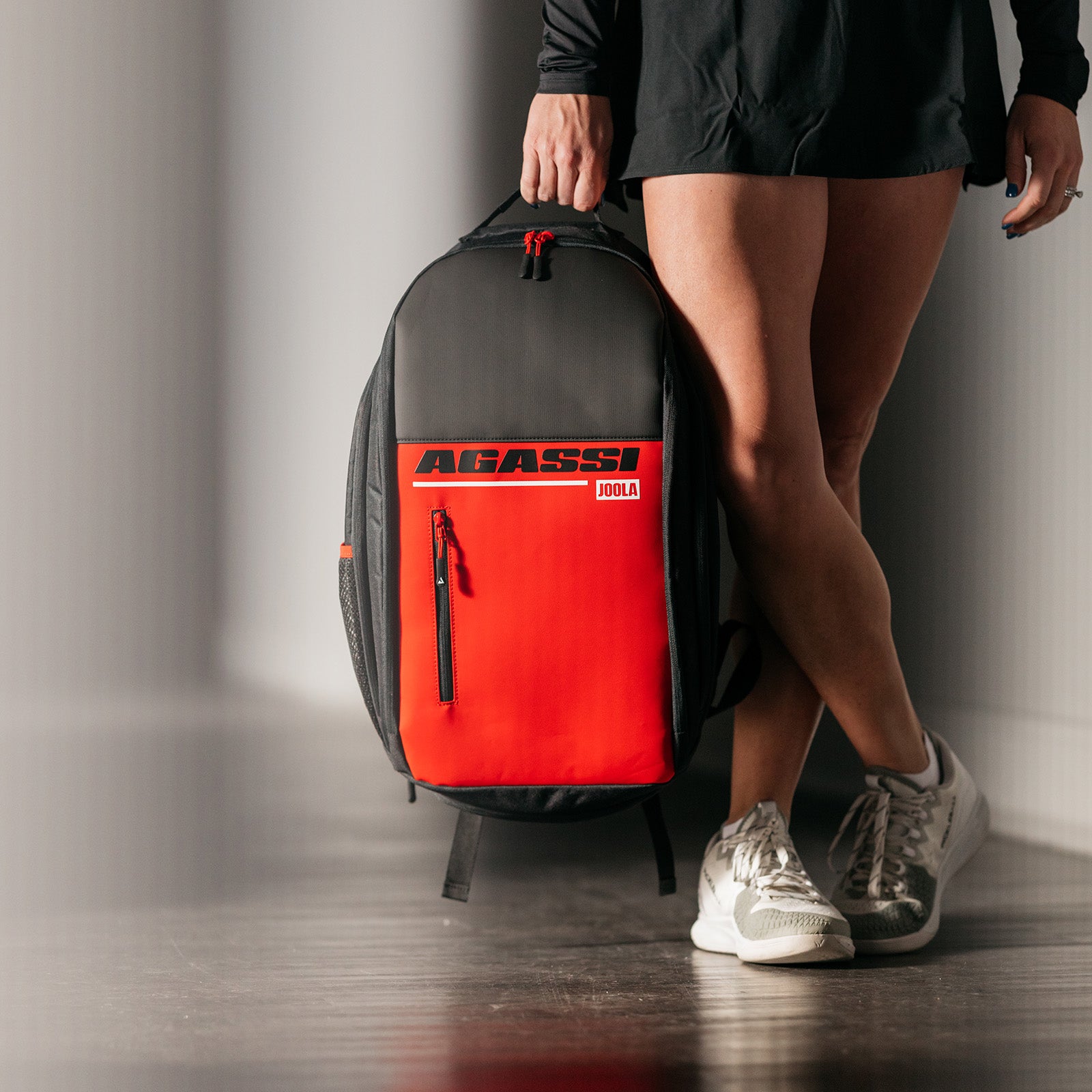 Close up image on the Agassi Vision II backpack in Brooke Buckner's hand.