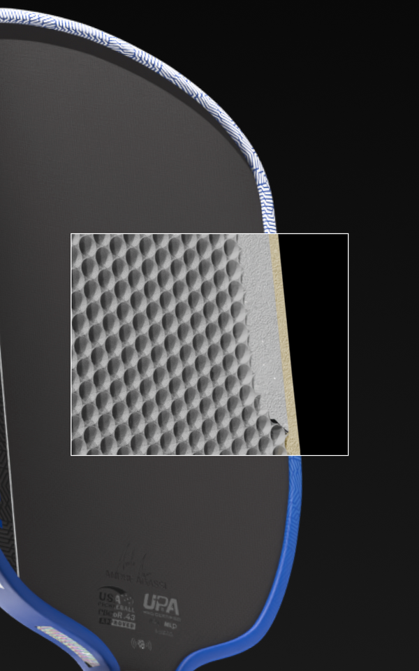 Close up on the detailed honeycomb core inside a JOOLA Agassi Pro V.