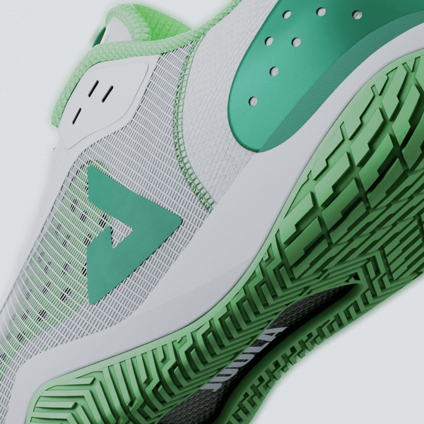 Green and white JOOLA R4LLy pickleball shoes with JOOLA trinity logo on a light gray background.