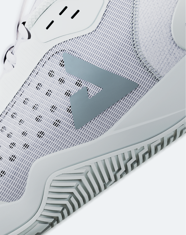 Close-up on the JOOLA Trinity logo on a pair of JOOLA Women's R4LLy pickleball shoes. 