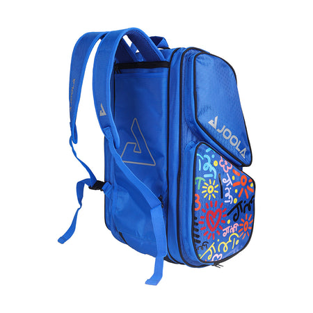 White Background Image: Blue BRITTO x JOOLA Tour Elite pickleball bag. Grey carrying straps, grey JOOLA x BRITO logo and unique BRITTO art design on the side.