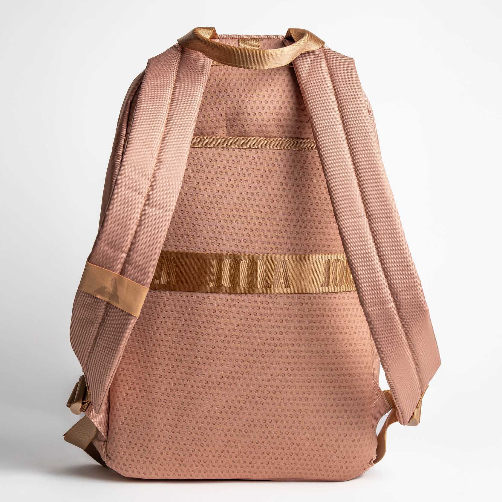 Gray background, product image of the JOOLA Back Pack, latte colored.
