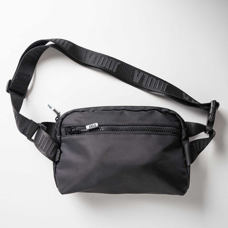 Gray background, product image of a black JOOLA Belt Bag.