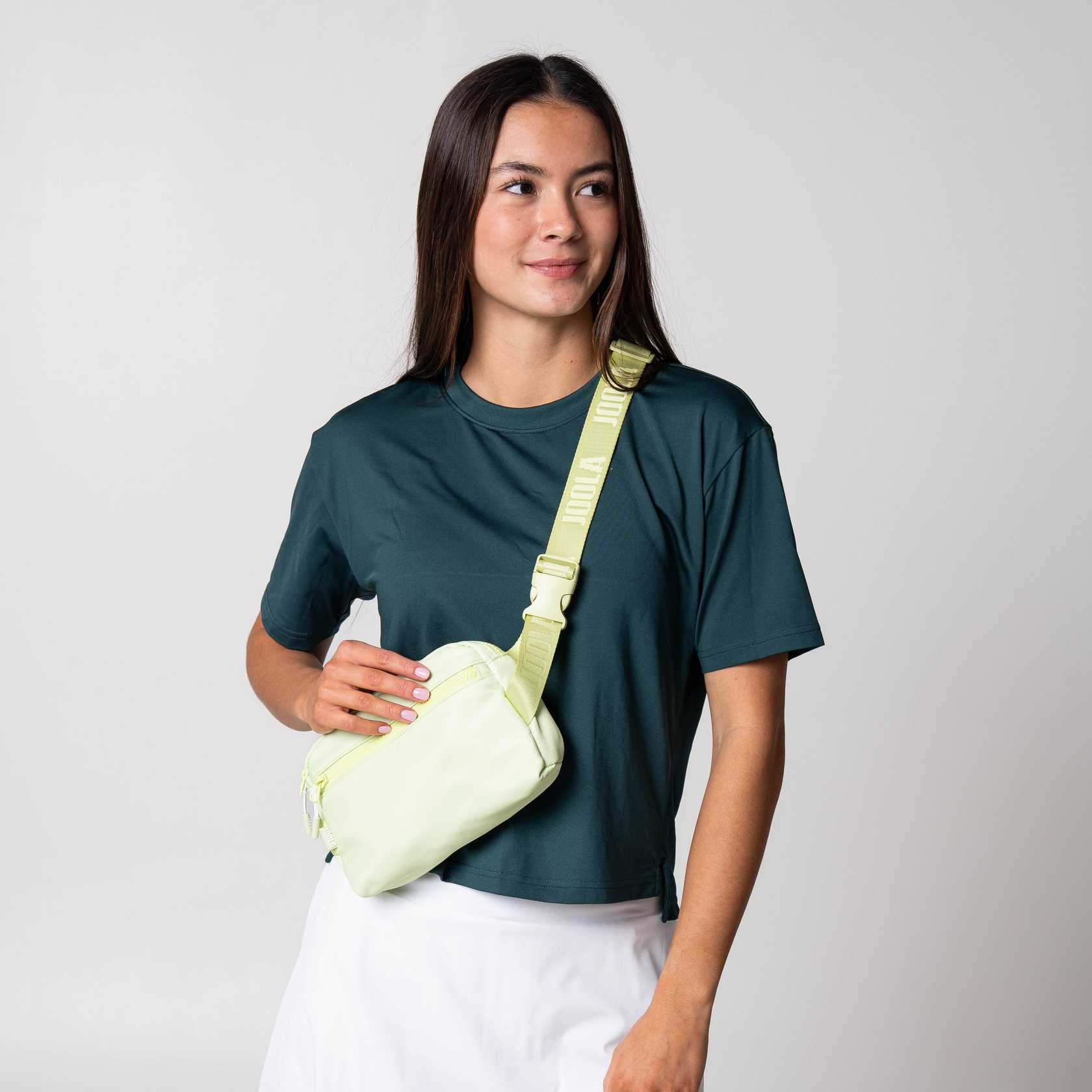 Gray background, product image of a Key Lime Colored JOOLA Belt Bag.