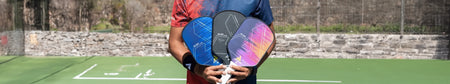 Header image of someone holding three Ben Johns Hyperion Gen 1 Pickleball Paddles.