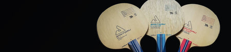 Black background horizontal image showing three professional table tennis blades.