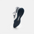 White background, product image showing the tred on the underside of a JOOLA R4LLy pickleball shoe, navy blue and white colorway.