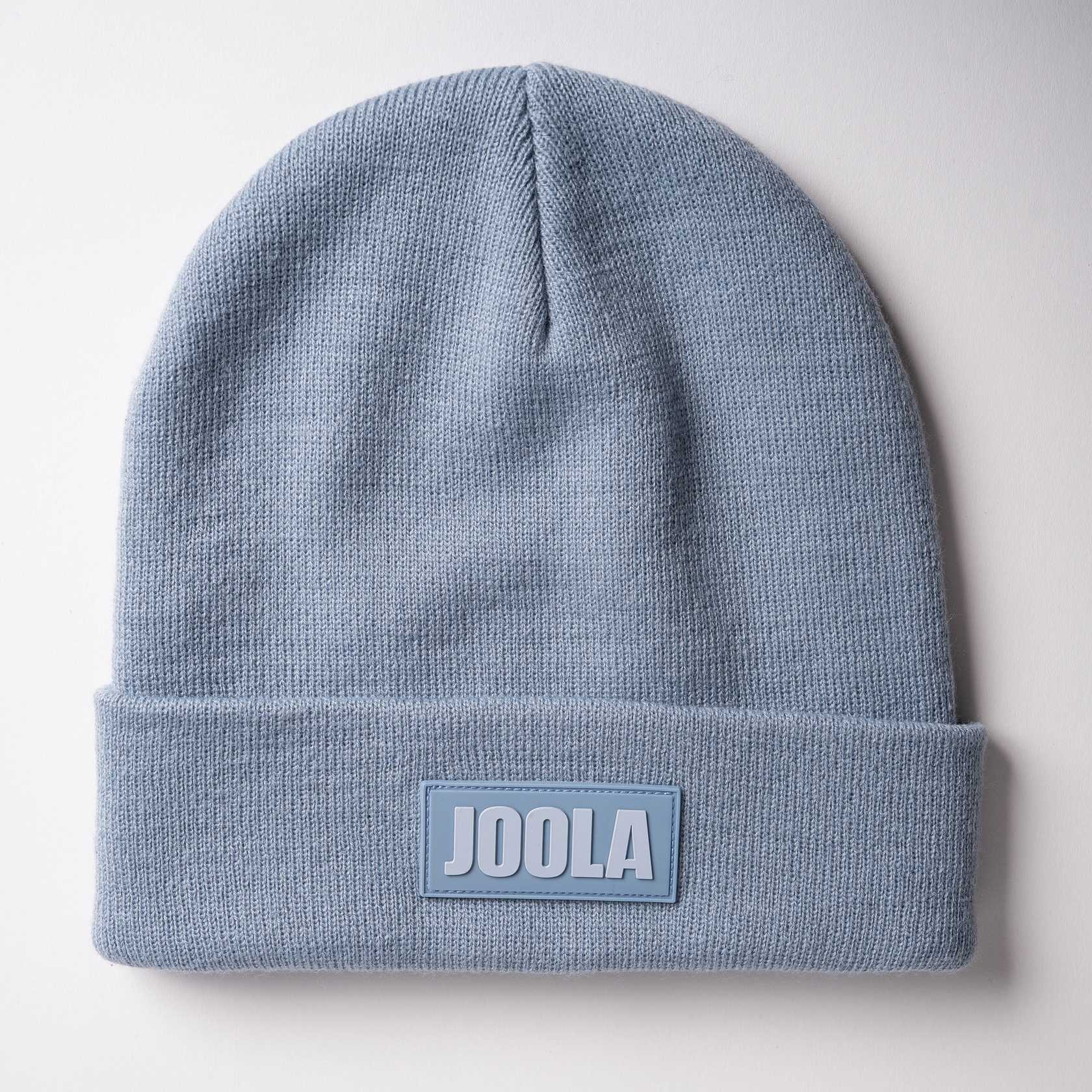 White background, product image of a JOOLA Cuff Beanie, blue.