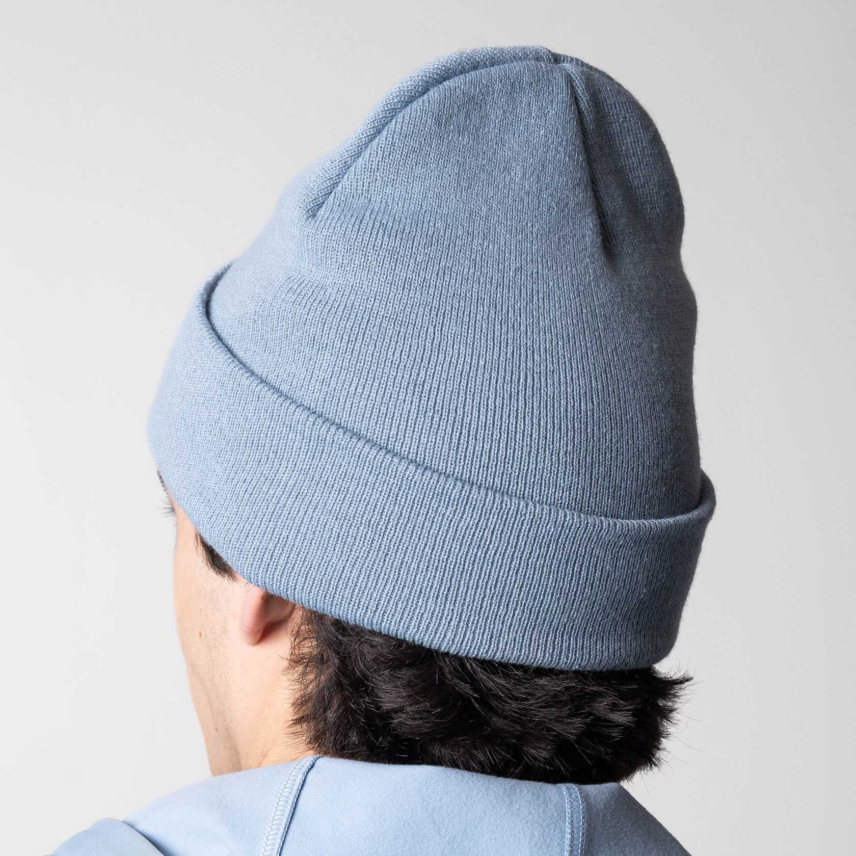 Image showing the back of a models head who is wearing a blue JOOLA Cuff Beanie.