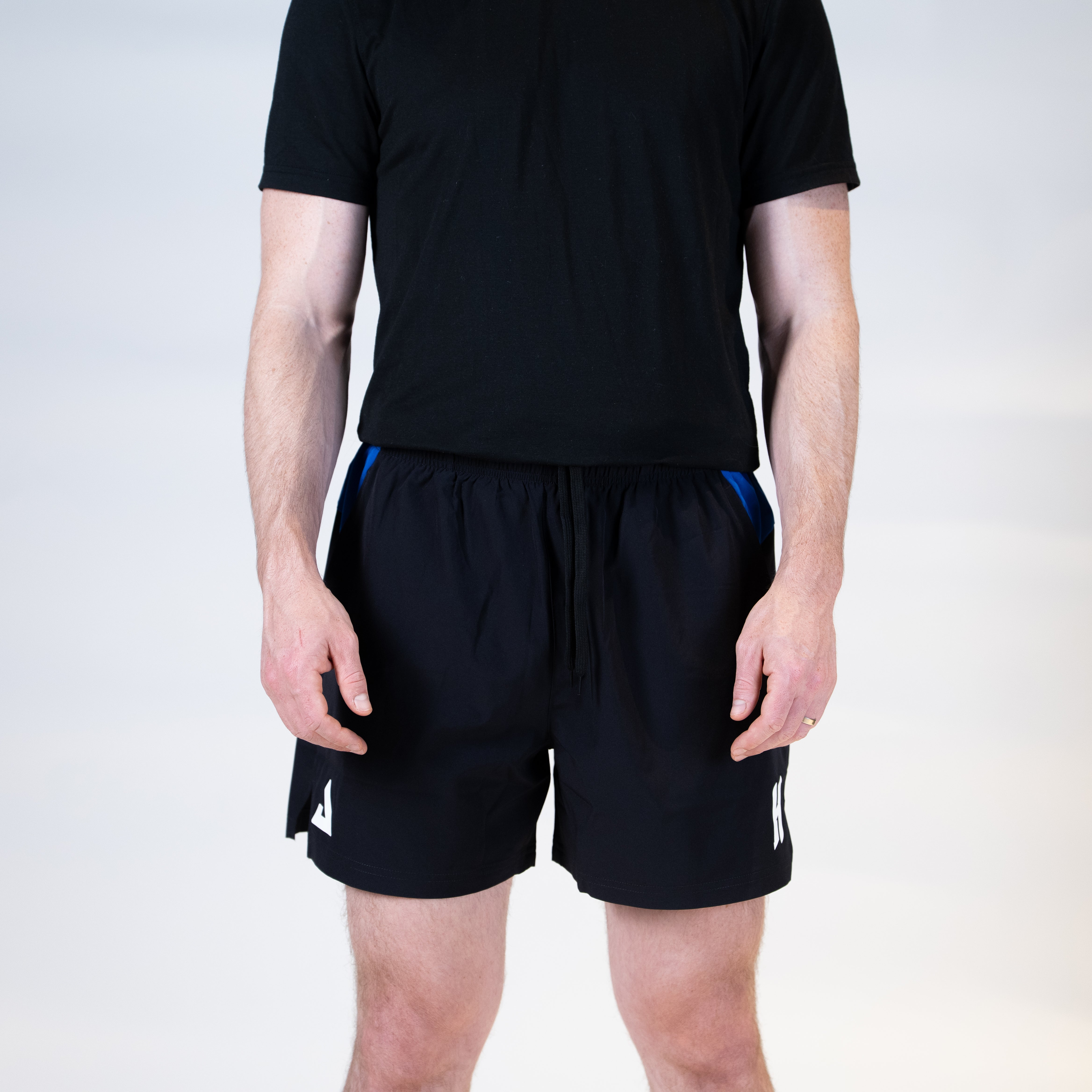 White background, product image of the JOOLA Hugo Calderano shorts, black and blue with a 5-inch inseam.