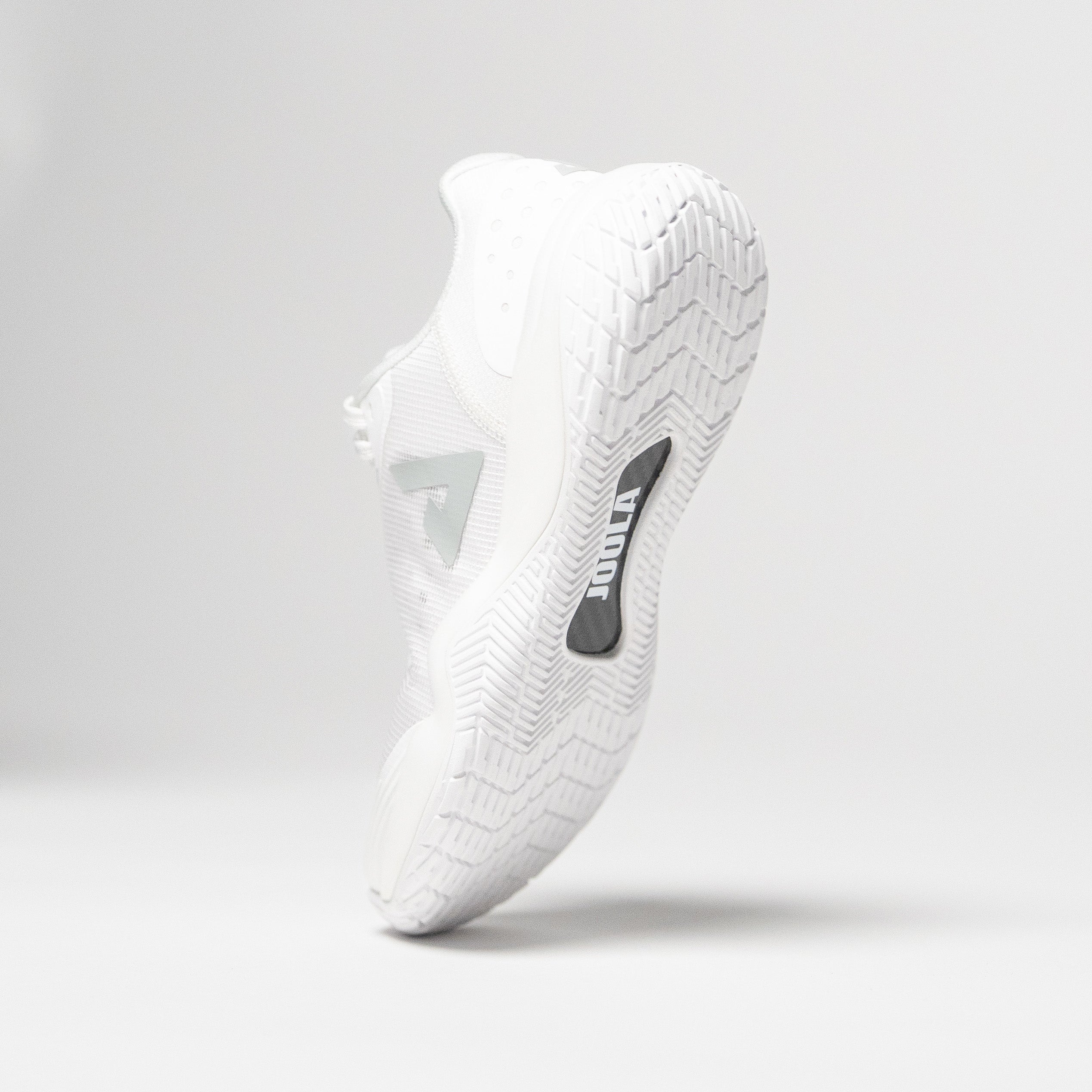 Image showing a single JOOLA R4LLy pickleball shoe, white colorway, with JOOLA Carbon Fiber shank pictured.