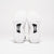 Image showing the bottom of a pair of JOOLA R4LLy pickleball shoes, the way the shoes are posed it's showing the JOOLA Branded Carbon Fiber Shank in the sole of the shoe.