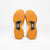 White background, product image showing the bottom of a pair of Men's R4LLy pickleball shoes, gum sole.