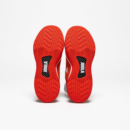 White background, product image of the JOOLA Red R4LLy Pickleball shoes stood up to reveal the carbon fiber shank in the sole of the shoe.