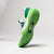 White background, image of the JOOLA R4LLy women's green and white limited-edition show.