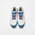 White background, top down view of the JOOLA R4LLy pickleball shoe, white and blue colorway.