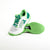 White background, stylized image of a pair of JOOLA R4LLy pickleball shoes, green and white colorway.