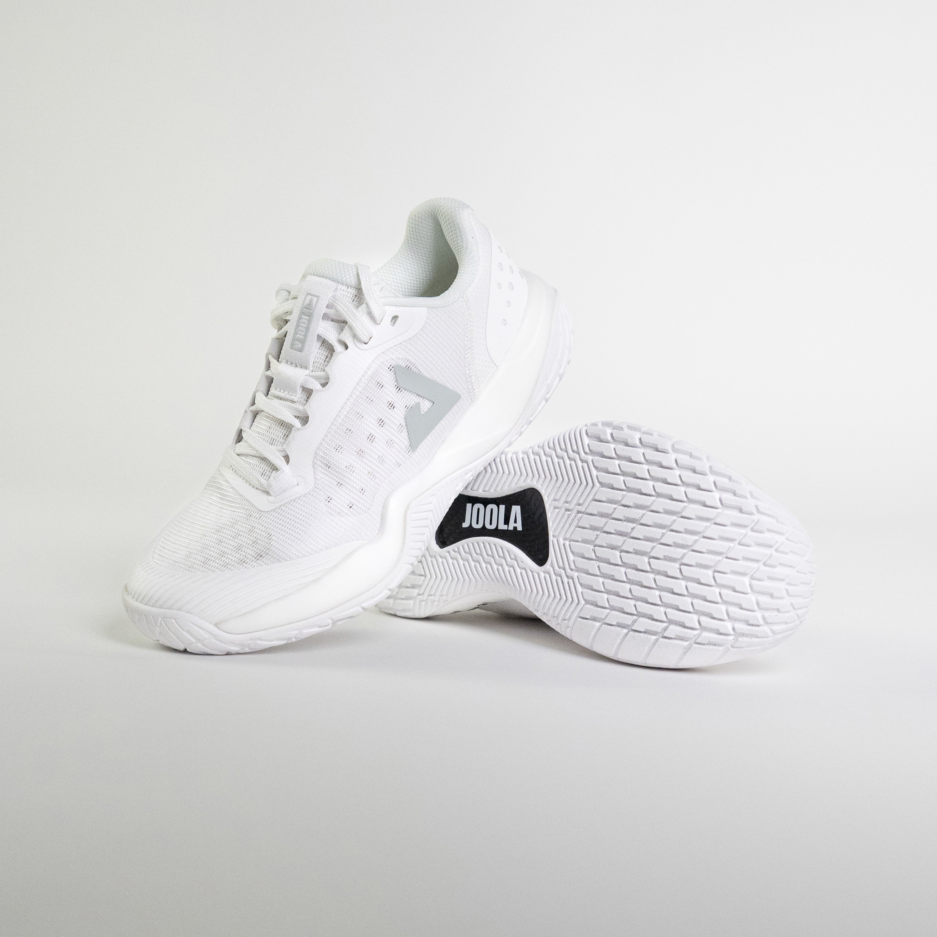 Stylized shot of the JOOLA R4LLy pickleball shoe in white.