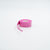 A roll of bright pink JOOLA overgrip with a small strip uncoiled, set against a clean white background. The brand name 'JOOLA' is embossed on the side of the roll.